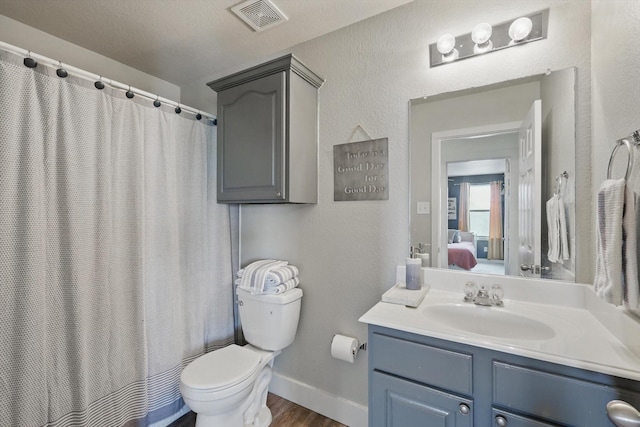 3964 Hunter Peak Rd, Fort Worth, TX 76262 - bathroom with vanity, toilet, connected bathroom, baseboards, and curtained shower