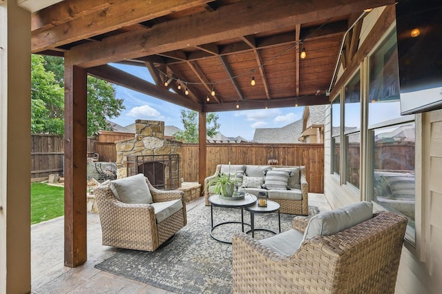 3964 Hunter Peak Rd, Fort Worth, TX 76262 - fenced backyard with an outdoor living space with a fireplace and a patio area