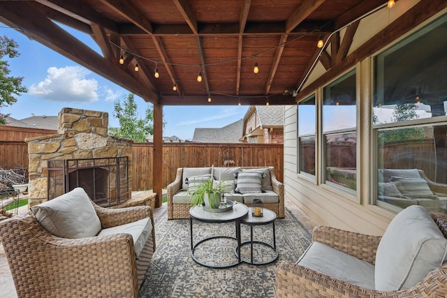 3964 Hunter Peak Rd, Fort Worth, TX 76262 - fenced backyard featuring an outdoor living space with a fireplace and a patio