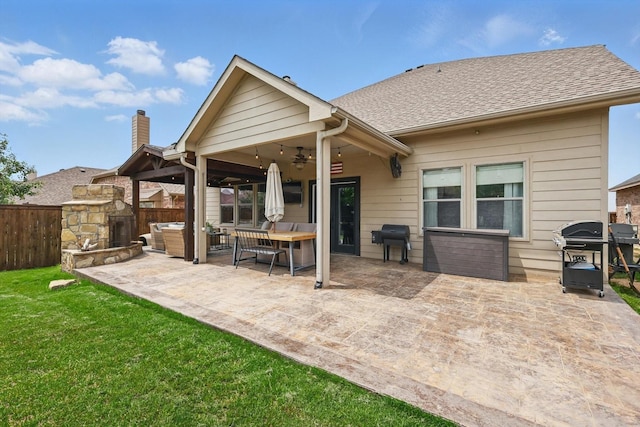 3964 Hunter Peak Rd, Fort Worth, TX 76262 - rear view of house with ceiling fan, a patio, a chimney, and an outdoor living space with a fireplace