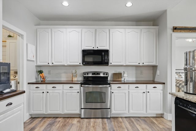 3964 Hunter Peak Rd, Fort Worth, TX 76262 - kitchen with black appliances, dark countertops, white cabinets, and recessed lighting
