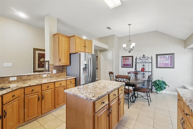 110 Lakeshore Dr, Trophy Club, TX 76262 - kitchen featuring stainless steel fridge, light tile patterned flooring, decorative backsplash, light stone counters, and vaulted ceiling