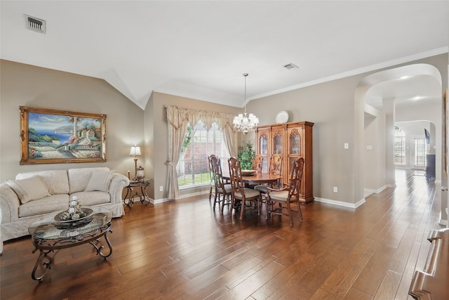 110 Lakeshore Dr, Trophy Club, TX 76262 - dining space featuring arched walkways, wood finished floors, a chandelier, baseboards, and crown molding