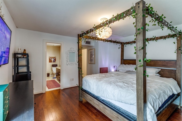 5816 Birchbrook Dr Unit 118, Dallas, TX 75206 - bedroom with wood finished floors, baseboards, and a chandelier