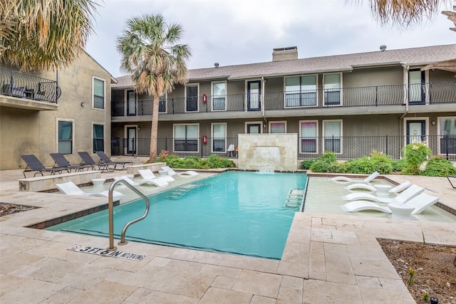 5816 Birchbrook Dr Unit 118, Dallas, TX 75206 - community pool featuring a patio area