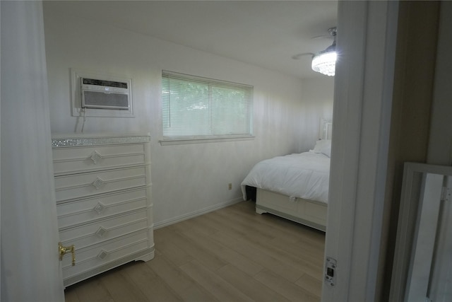 706 Midway Dr W, Euless, TX 76039 - bedroom featuring light wood-style flooring, a wall mounted AC, and baseboards