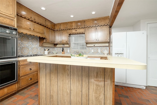 3410 Ellis Ave, Fort Worth, TX 76106 - kitchen with light countertops, backsplash, brick flooring, white fridge with ice dispenser, and a kitchen island