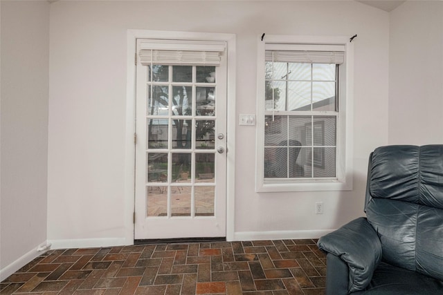 3410 Ellis Ave, Fort Worth, TX 76106 - doorway with baseboards and brick patterned flooring