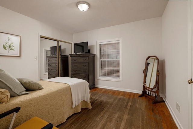 3410 Ellis Ave, Fort Worth, TX 76106 - bedroom featuring dark wood finished floors, a closet, and baseboards