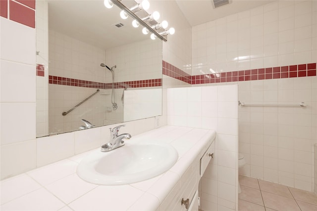 3410 Ellis Ave, Fort Worth, TX 76106 - full bathroom with vanity, toilet, tile walls, and tiled shower