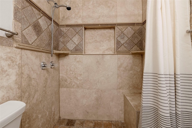 3410 Ellis Ave, Fort Worth, TX 76106 - bathroom featuring a tile shower and toilet