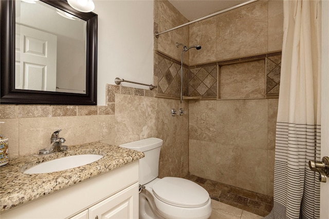 3410 Ellis Ave, Fort Worth, TX 76106 - bathroom with tile walls, vanity, toilet, and a tile shower