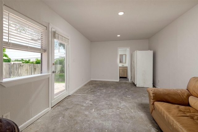 3410 Ellis Ave, Fort Worth, TX 76106 - sitting room featuring baseboards, concrete flooring, and recessed lighting