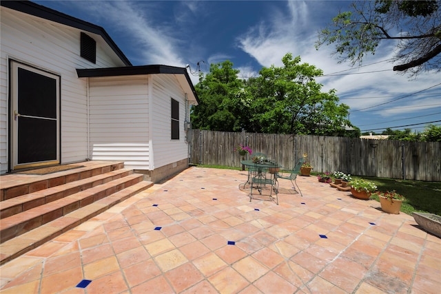 3410 Ellis Ave, Fort Worth, TX 76106 - fenced backyard with a patio and outdoor dining area