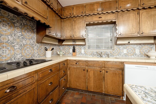 3410 Ellis Ave, Fort Worth, TX 76106 - kitchen featuring tile countertops, brown cabinets, and brick floors
