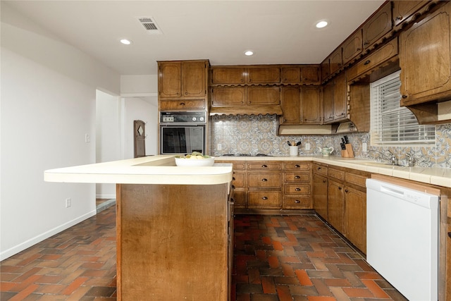 3410 Ellis Ave, Fort Worth, TX 76106 - kitchen featuring black oven, dishwasher, baseboards, tasteful backsplash, and recessed lighting
