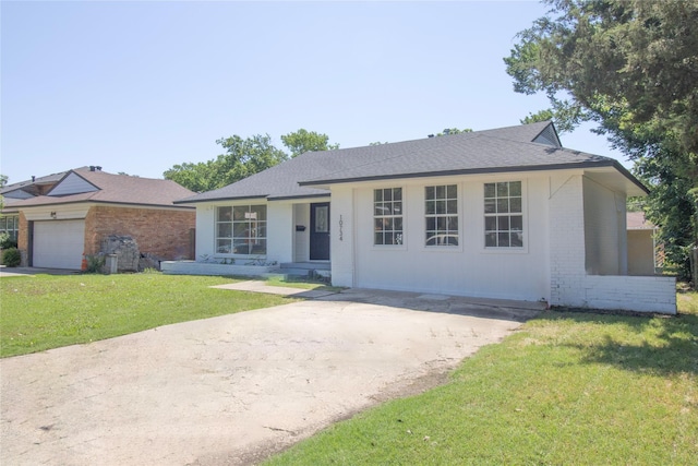 10734 Coogan Dr, Dallas, TX 75229 - ranch-style house featuring brick siding, a front yard, roof with shingles, and driveway