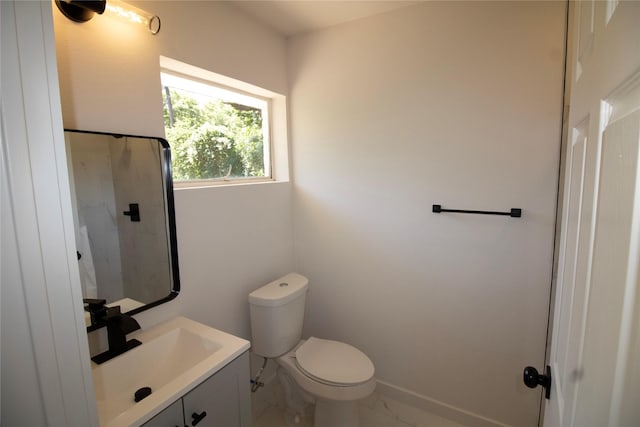 10734 Coogan Dr, Dallas, TX 75229 - bathroom with marble finish floors, vanity, and toilet