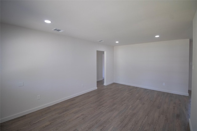 10734 Coogan Dr, Dallas, TX 75229 - unfurnished room featuring recessed lighting, dark wood-style flooring, and baseboards
