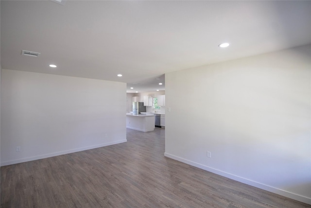 10734 Coogan Dr, Dallas, TX 75229 - empty room with recessed lighting, wood finished floors, and baseboards