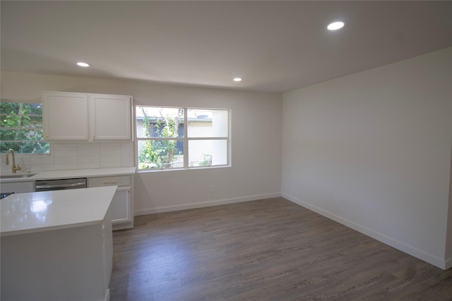 10734 Coogan Dr, Dallas, TX 75229 - kitchen with a sink, light countertops, wood finished floors, stainless steel dishwasher, and recessed lighting
