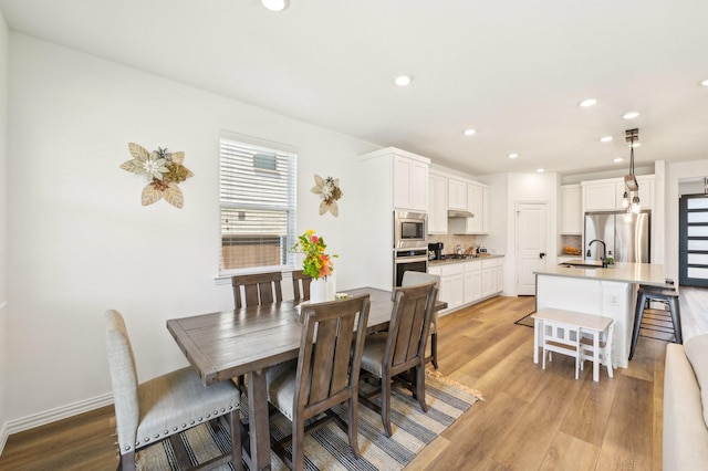 1213 Palmetto Dr, Forney, TX 75126 - dining area featuring light wood-type flooring and recessed lighting