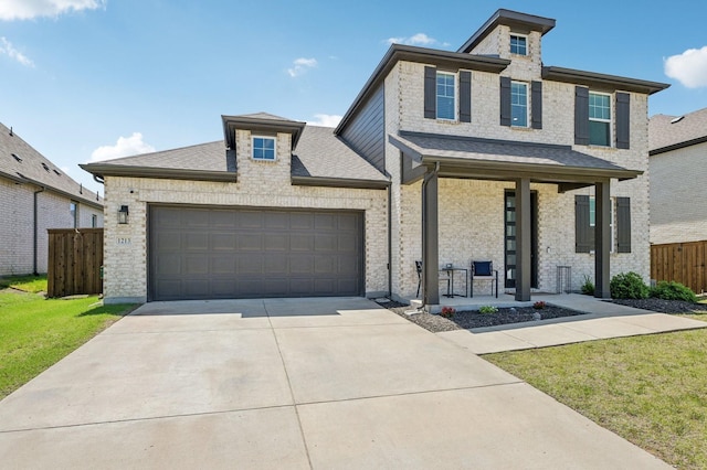 1213 Palmetto Dr, Forney, TX 75126 - view of front of home with driveway, a porch, an attached garage, and a shingled roof