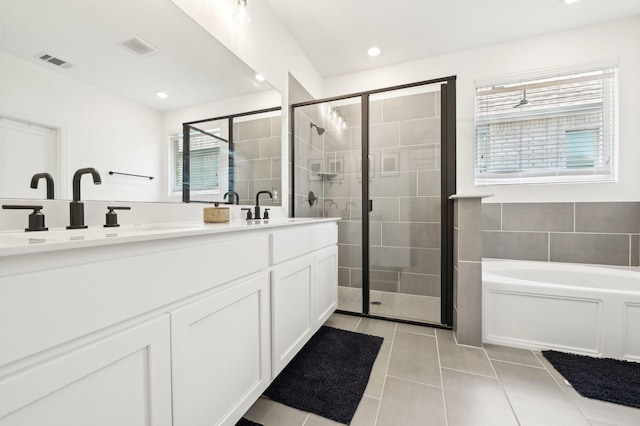 1213 Palmetto Dr, Forney, TX 75126 - full bathroom with double vanity, a garden tub, a shower stall, tile patterned flooring, and recessed lighting