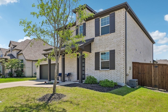 1213 Palmetto Dr, Forney, TX 75126 - view of front of house featuring concrete driveway, brick siding, and a garage