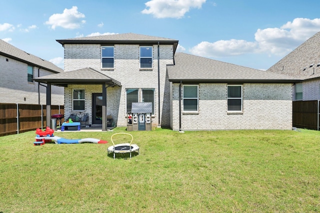 1213 Palmetto Dr, Forney, TX 75126 - rear view of house featuring an outdoor fire pit, a patio area, brick siding, and roof with shingles