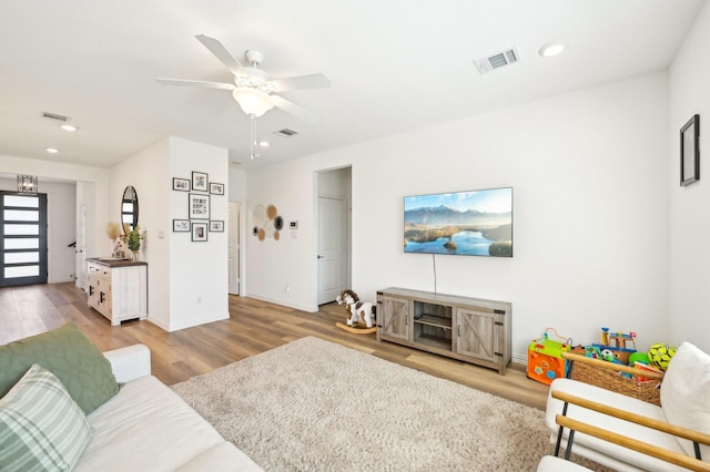 1213 Palmetto Dr, Forney, TX 75126 - living room with wood finished floors, recessed lighting, ceiling fan, and baseboards
