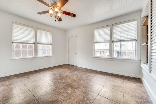 1833 Mcmillan Ave, Dallas, TX 75206 - spare room with a ceiling fan, tile patterned flooring, baseboards, and crown molding