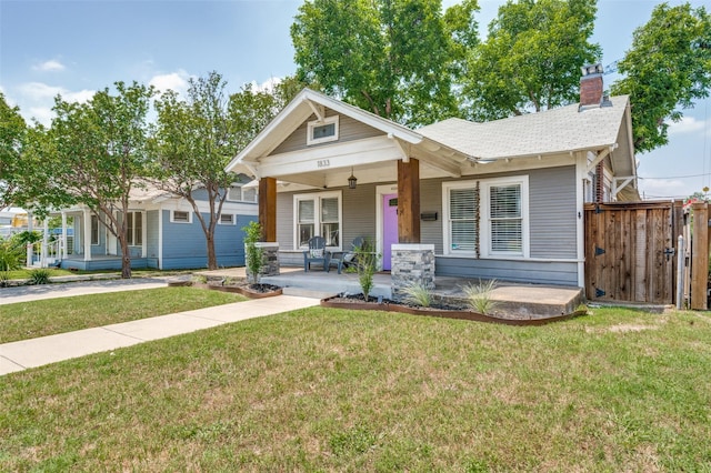 1833 Mcmillan Ave, Dallas, TX 75206 - view of front of property with a porch and a chimney