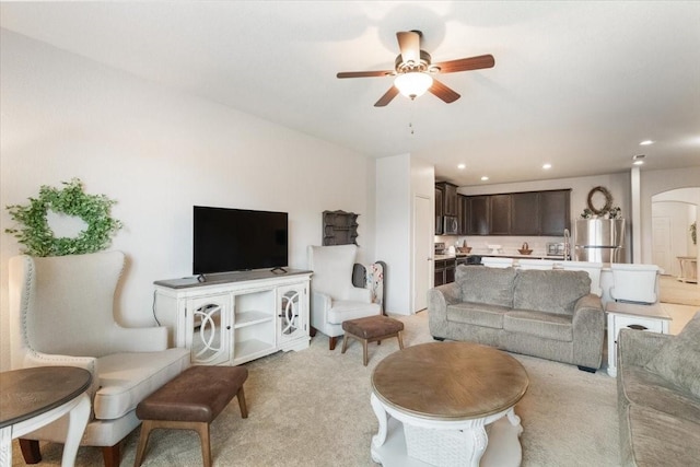 2113 Brenham Dr, Forney, TX 75126 - living room featuring arched walkways, ceiling fan, light colored carpet, and recessed lighting
