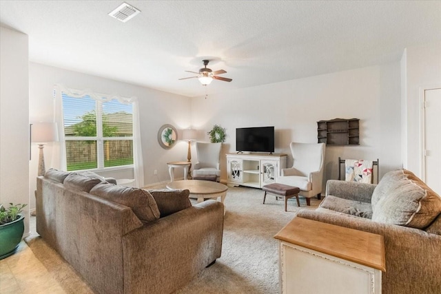 2113 Brenham Dr, Forney, TX 75126 - living area with ceiling fan, light carpet, and baseboards