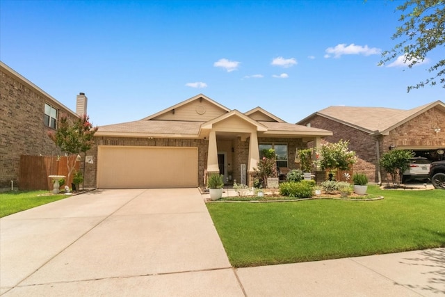 2113 Brenham Dr, Forney, TX 75126 - view of front of home featuring an attached garage, brick siding, driveway, and a front lawn