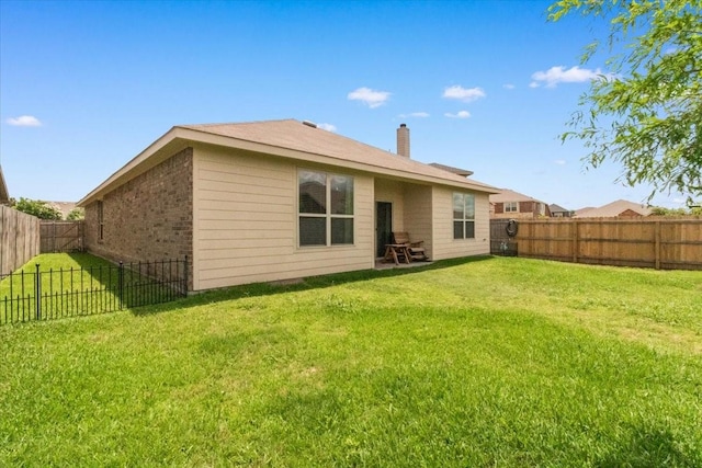 2113 Brenham Dr, Forney, TX 75126 - back of house featuring a chimney
