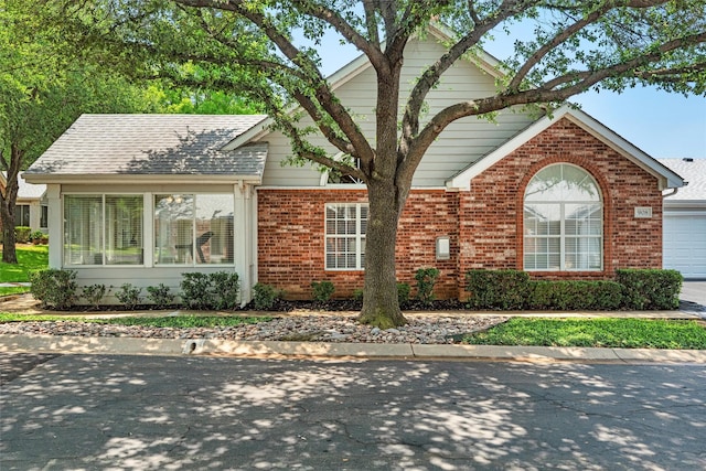 908 Bridges Dr, Arlington, TX 76012 - ranch-style house featuring brick siding and a garage