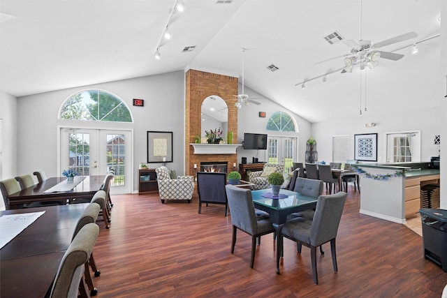 908 Bridges Dr, Arlington, TX 76012 - dining space featuring rail lighting, french doors, ceiling fan, and high vaulted ceiling