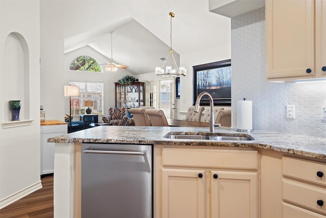 908 Bridges Dr, Arlington, TX 76012 - kitchen featuring a sink, dishwasher, dark wood finished floors, vaulted ceiling, and a peninsula