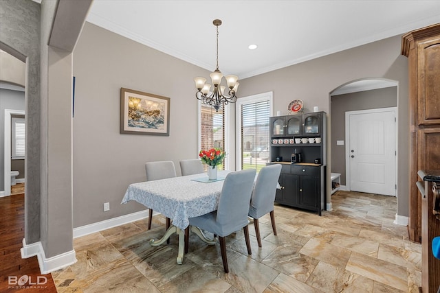 1109 Laurel Creek Dr, Shreveport, LA 71106 - dining room featuring arched walkways, crown molding, a chandelier, baseboards, and recessed lighting