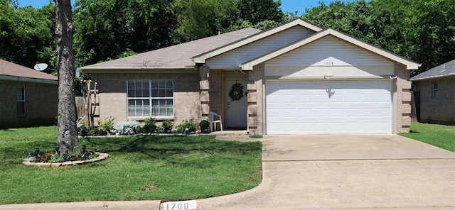 1708 N Bent Tree Trl, Grand Prairie, TX 75052 - single story home with brick siding, concrete driveway, a garage, and a front lawn
