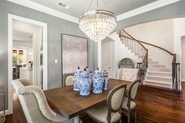 913 Bristlewood Dr, Mckinney, TX 75072 - dining area with stairs, a chandelier, wood finished floors, ornamental molding, and baseboards
