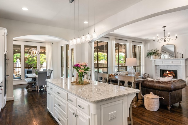 913 Bristlewood Dr, Mckinney, TX 75072 - kitchen featuring a kitchen island, dark wood-style flooring, a chandelier, and recessed lighting
