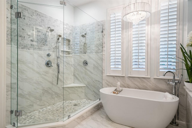 913 Bristlewood Dr, Mckinney, TX 75072 - bathroom with a freestanding tub, a shower stall, and marble finish flooring