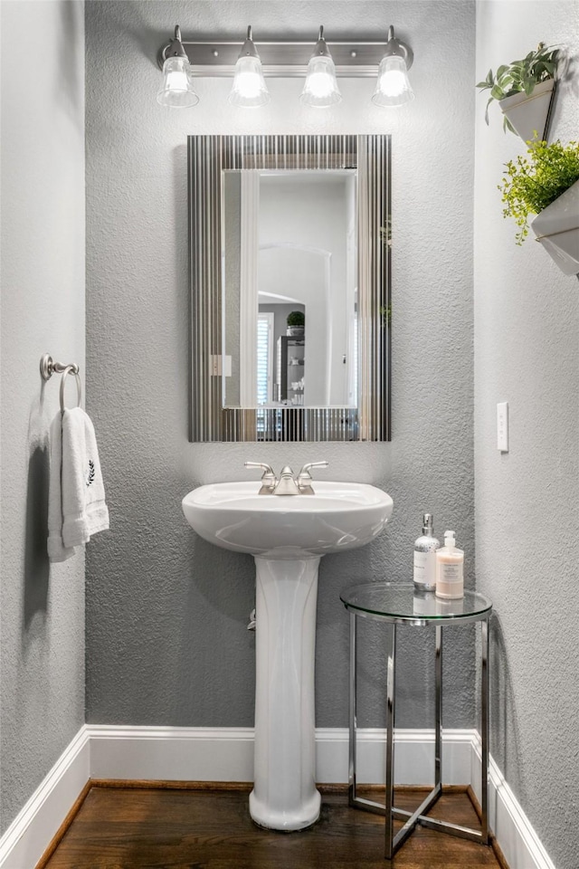 913 Bristlewood Dr, Mckinney, TX 75072 - bathroom with wood finished floors and baseboards