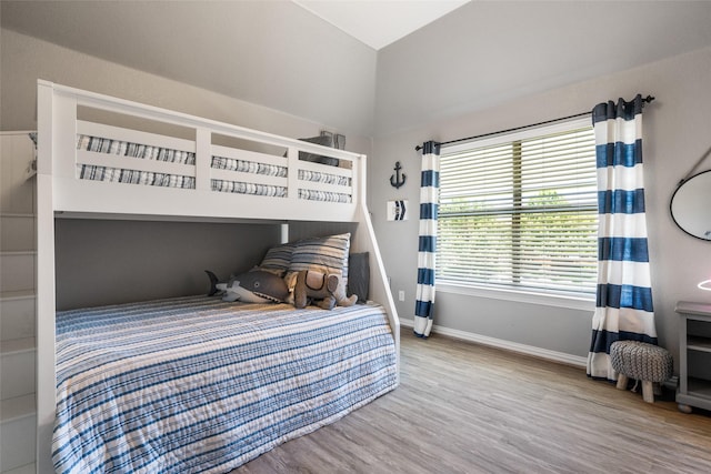 913 Bristlewood Dr, Mckinney, TX 75072 - bedroom with vaulted ceiling, baseboards, and wood finished floors