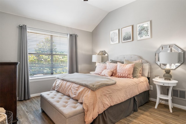 913 Bristlewood Dr, Mckinney, TX 75072 - bedroom with wood finished floors, vaulted ceiling, and baseboards