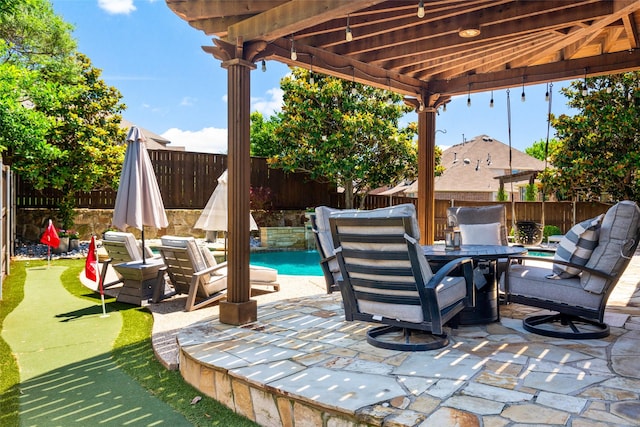913 Bristlewood Dr, Mckinney, TX 75072 - fenced backyard with a putting green, a patio area, and outdoor dining area