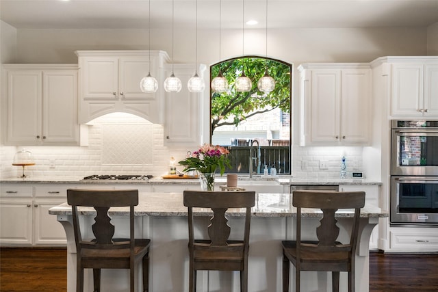 913 Bristlewood Dr, Mckinney, TX 75072 - kitchen with appliances with stainless steel finishes, white cabinets, tasteful backsplash, and recessed lighting